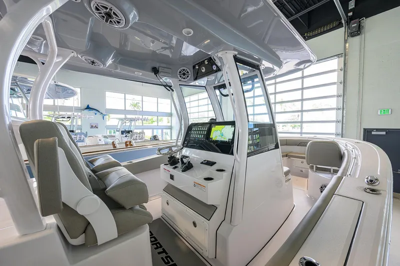 Slide: The Image of 2025 Sportsman Open 282 Center Console boat interior with advanced navigation system. - 7