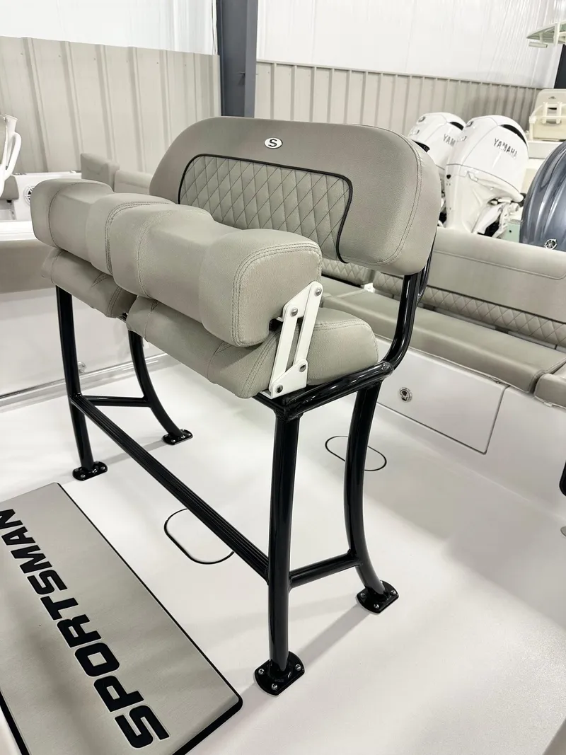 Slide: The Image of 2025 Sportsman Heritage 231 Center Console boat seating with cushioned backrest and sturdy frame. - 3