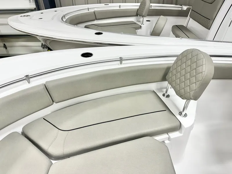 Slide: The Image of 2025 Sportsman Heritage 231 Center Console boat with cushioned seating and sleek design. - 9