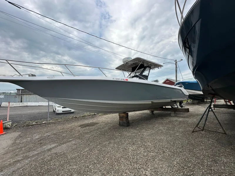 Slide: The Image of 1999 Donzi 35 ZF boat on dry dock under cloudy sky. - 4