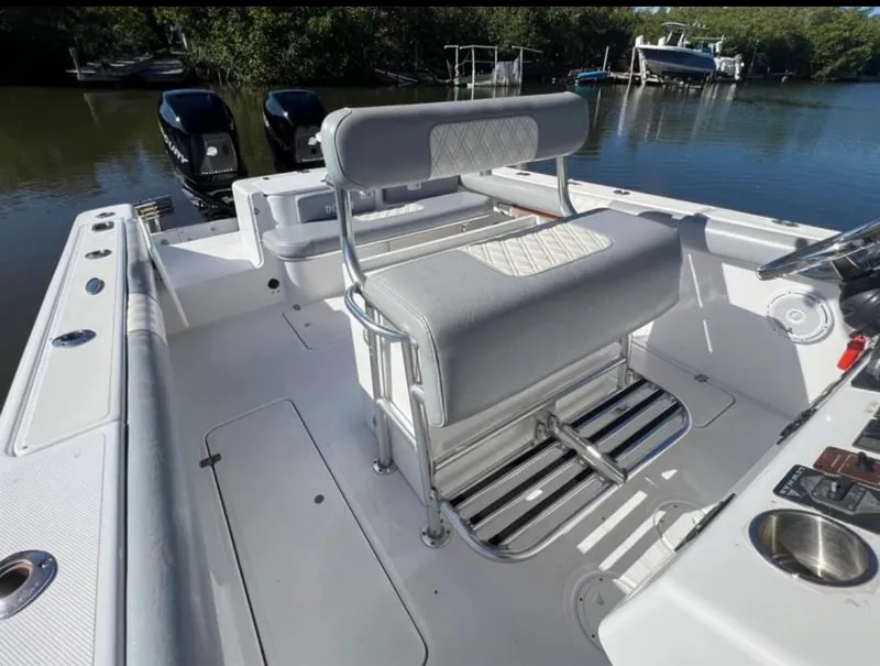 Slide: The Image of 1999 Donzi 35 ZF boat interior with seating and dual outboard motors. - 7