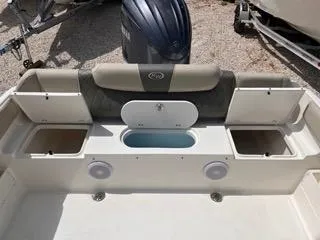 Slide: The Image of 2025 Key West 239 FS boat interior with storage compartments and seating. - 14