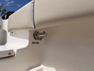 Slide: The Image of Key West 239 FS 2025 boat detail showing raw water outlet. - 19