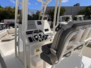 Slide: The Image of 2025 Key West 239 FS boat console with steering wheel and seating. - 21