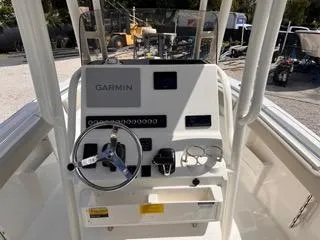 Slide: The Image of 2025 Key West 239 FS boat console with Garmin navigation system and steering wheel. - 22