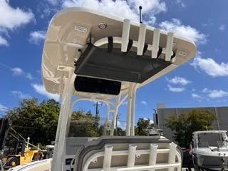 Slide: The Image of 2025 Key West 239 FS boat with T-top and rod holders under a blue sky. - 23