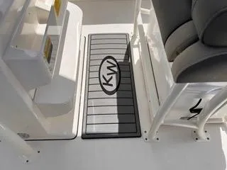 Slide: The Image of 2025 Key West 239 FS boat interior with KW logo mat and seating. - 28