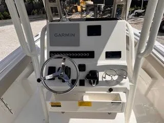 Slide: The Image of 2025 Key West 239 FS boat console with Garmin navigation system and steering wheel. - 29
