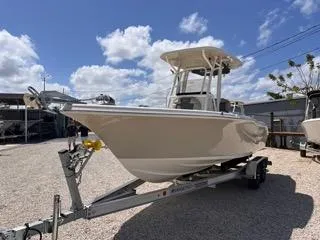 Slide: The Image of 2025 Key West 239 FS boat on trailer under blue sky. - 3