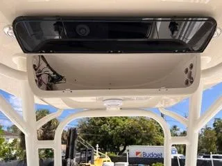 Slide: The Image of T-top console of 2025 Key West 239 FS boat, featuring storage and electronics. - 35