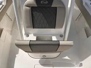Slide: The Image of 2025 Key West 239 FS boat seat with gray cushioning and sleek design. - 37