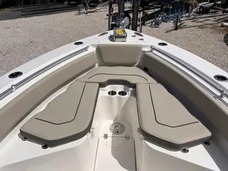 Slide: The Image of 2025 Key West 239 FS boat interior with beige seating and cup holders. - 39