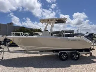 Slide: The Image of 2025 Key West 239 FS boat on trailer under cloudy sky. - 4