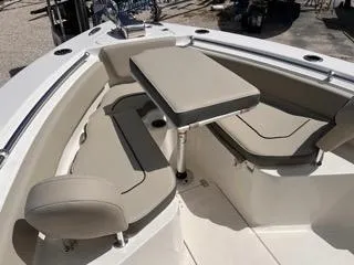Slide: The Image of 2025 Key West 239 FS boat interior with beige seating and table. - 41