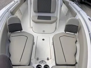 Slide: The Image of 2025 Key West 239 FS boat interior with cushioned seating and storage compartments. - 42