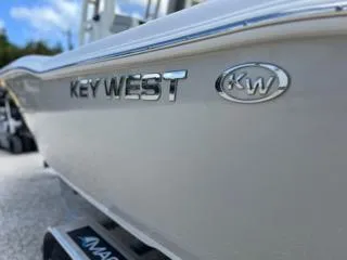 Slide: The Image of 2025 Key West 239 FS boat side view with logo and emblem. - 45