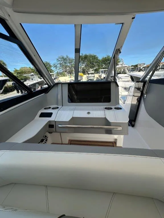 Slide: The Image of 2023 Regal LX36 boat interior with sleek design and modern dashboard. - 15