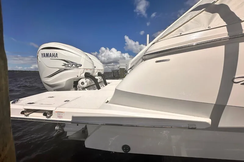 Slide: The Image of 2023 Regal LX36 boat with Yamaha XTO outboard engine on a sunny day. - 4