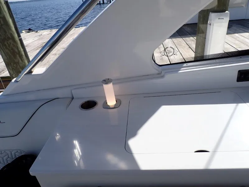 Slide: The Image of 2023 Regal LX36 boat interior with sleek white design and ocean view. - 42