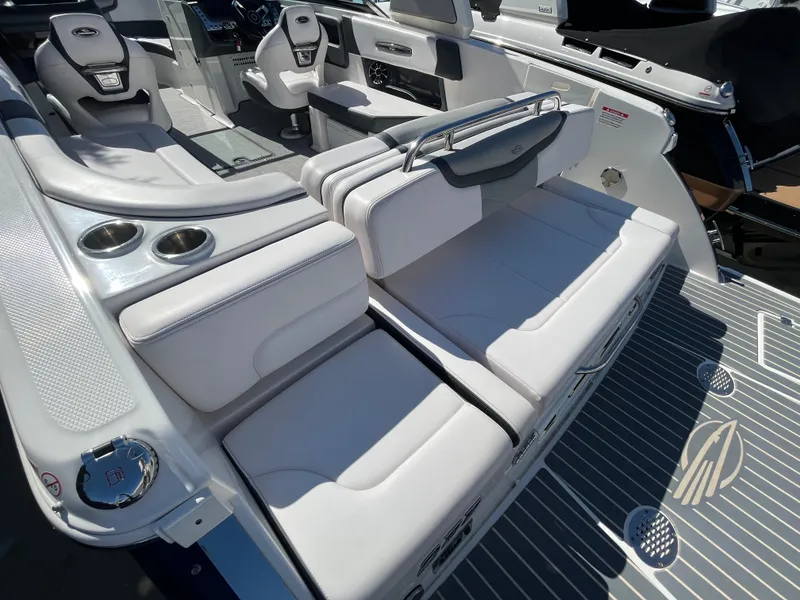 Slide: The Image of 2019 Chaparral 277 SSX boat interior with luxurious seating and cup holders. - 14