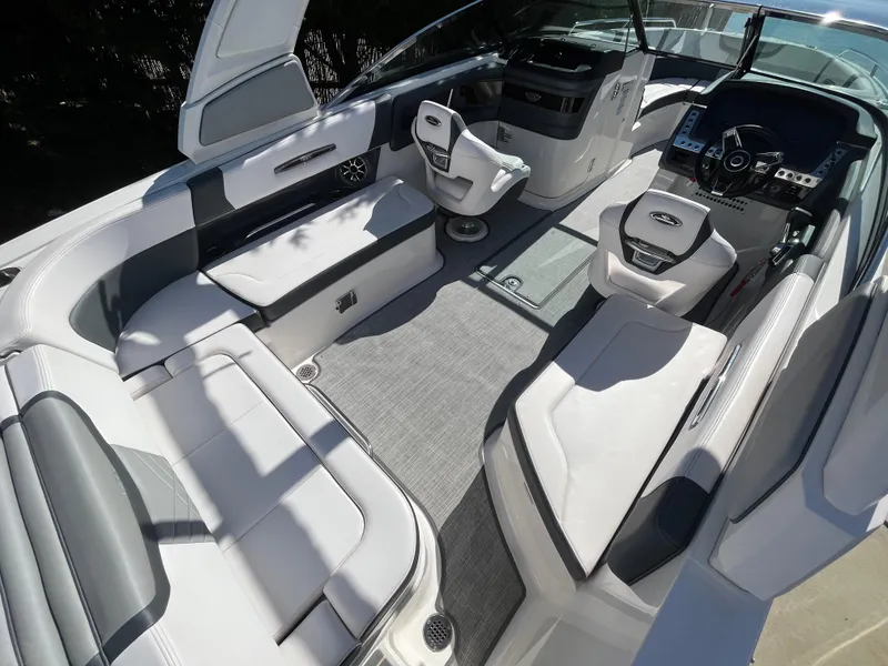 Slide: The Image of 2019 Chaparral 277 SSX boat interior with luxurious seating and modern dashboard. - 17