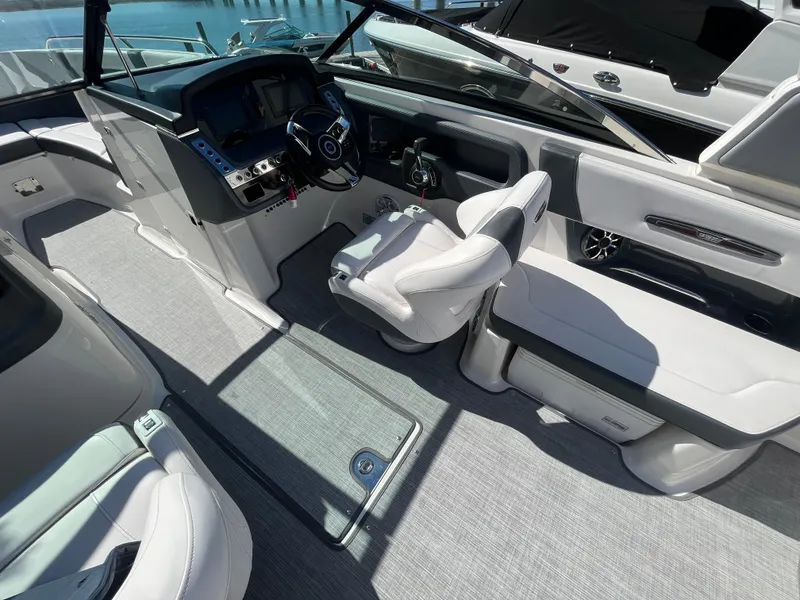 Slide: The Image of 2019 Chaparral 277 SSX boat interior with modern helm and seating. - 24