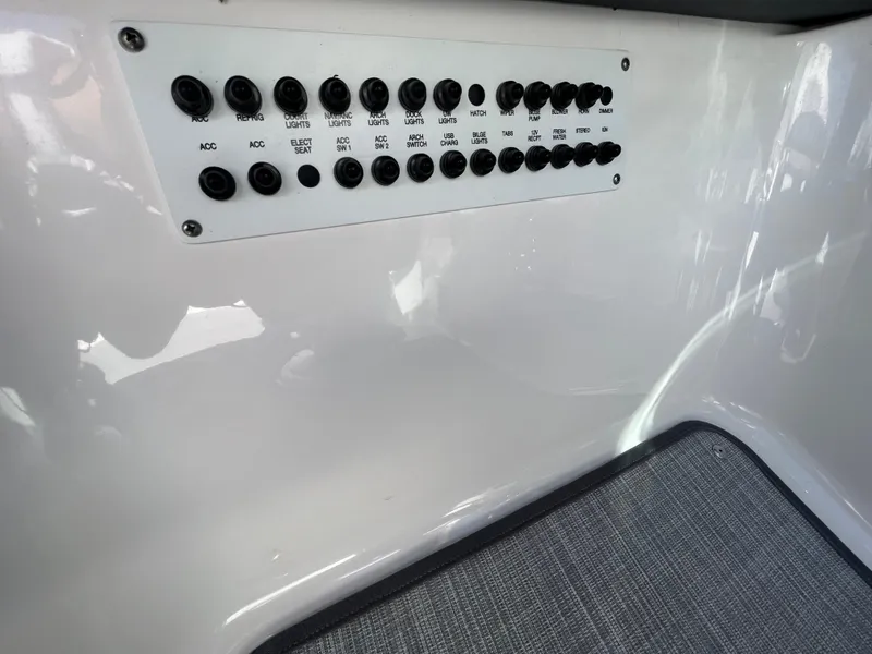 Slide: The Image of Control panel of a 2019 Chaparral 277 SSX boat with multiple switches. - 29