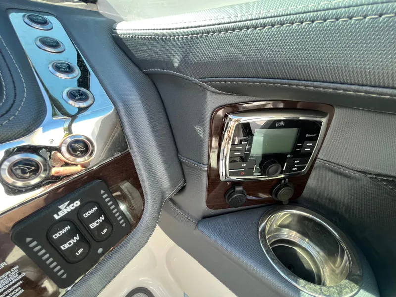 Slide: The Image of 2019 Chaparral 277 SSX boat dashboard with control panel and cup holder. - 30
