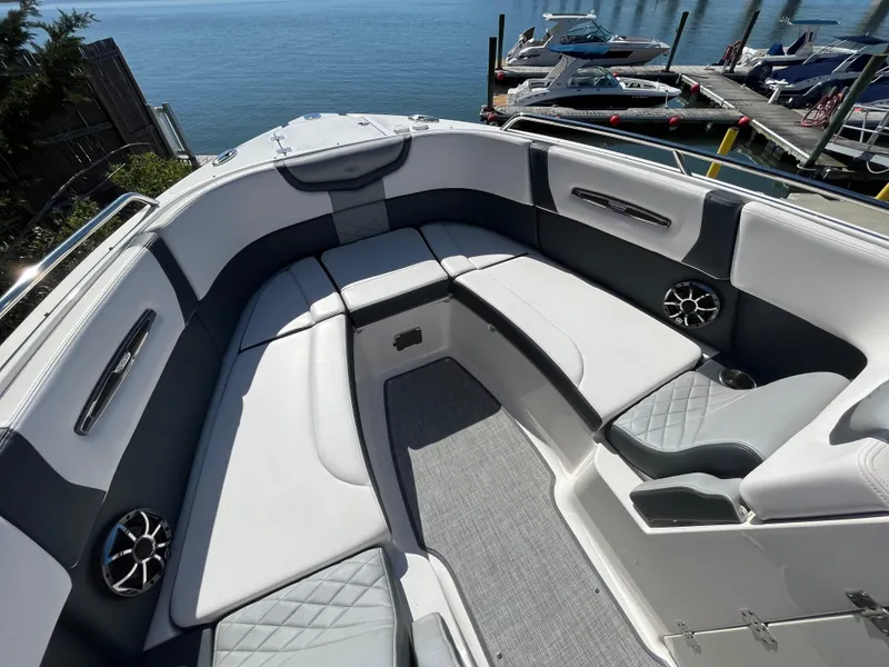 Slide: The Image of 2019 Chaparral 277 SSX boat interior with spacious seating and waterfront view. - 36