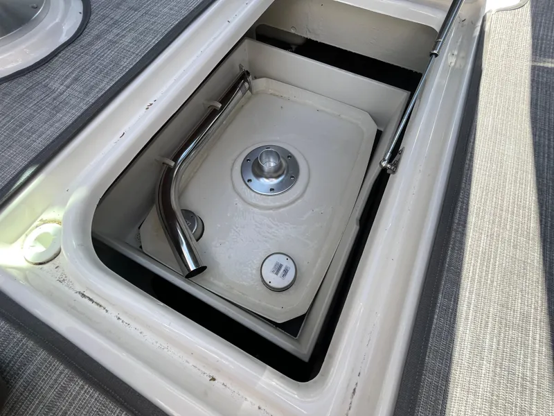 Slide: The Image of 2019 Chaparral 277 SSX boat storage compartment with stainless steel handle and latch. - 40