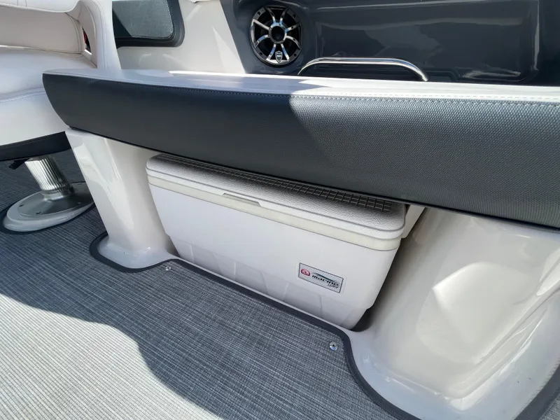 Slide: The Image of 2019 Chaparral 277 SSX boat interior with built-in cooler and speaker. - 41