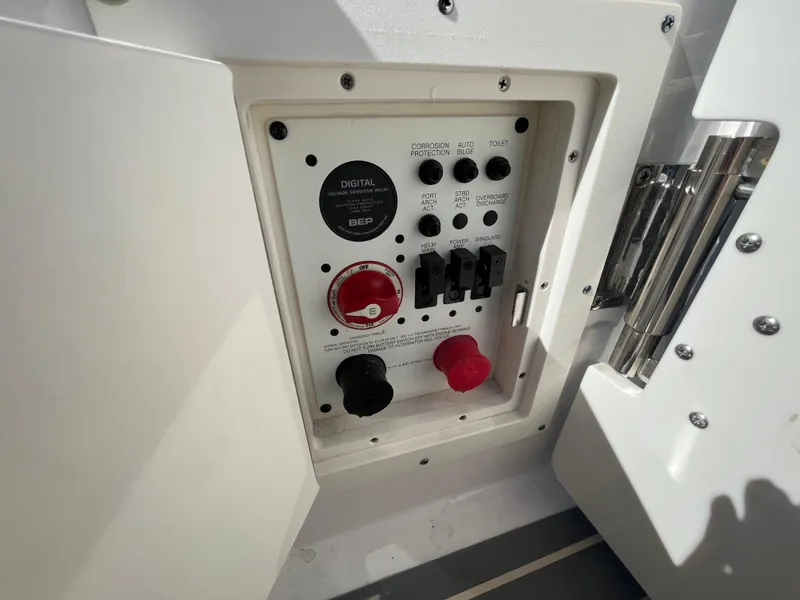 Slide: The Image of Control panel of a 2019 Chaparral 277 SSX boat, featuring switches and dials. - 44