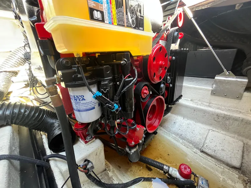 Slide: The Image of Engine compartment of 2019 Chaparral 277 SSX boat, featuring Volvo Penta components. - 46