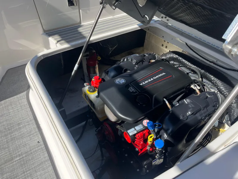 Slide: The Image of Engine compartment of 2019 Chaparral 277 SSX boat, showcasing powerful motor components. - 47