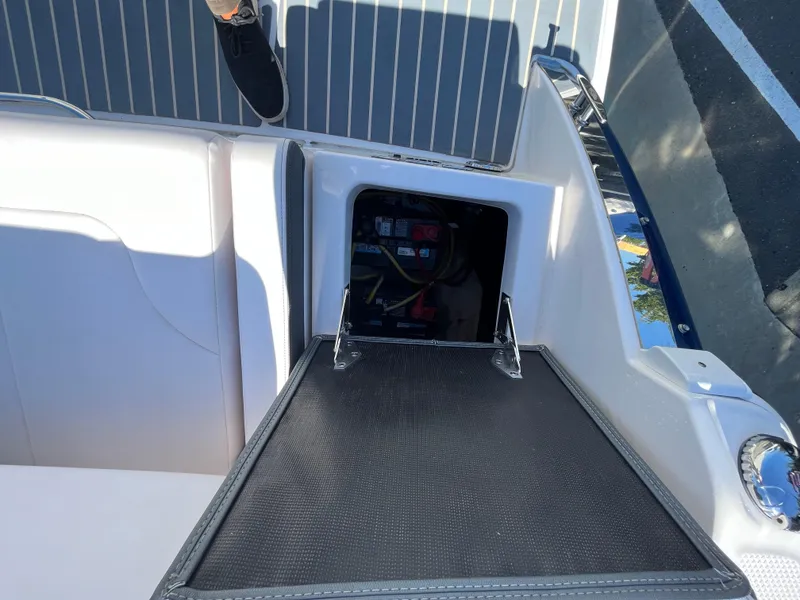 Slide: The Image of 2019 Chaparral 277 SSX boat with open storage compartment on deck. - 49