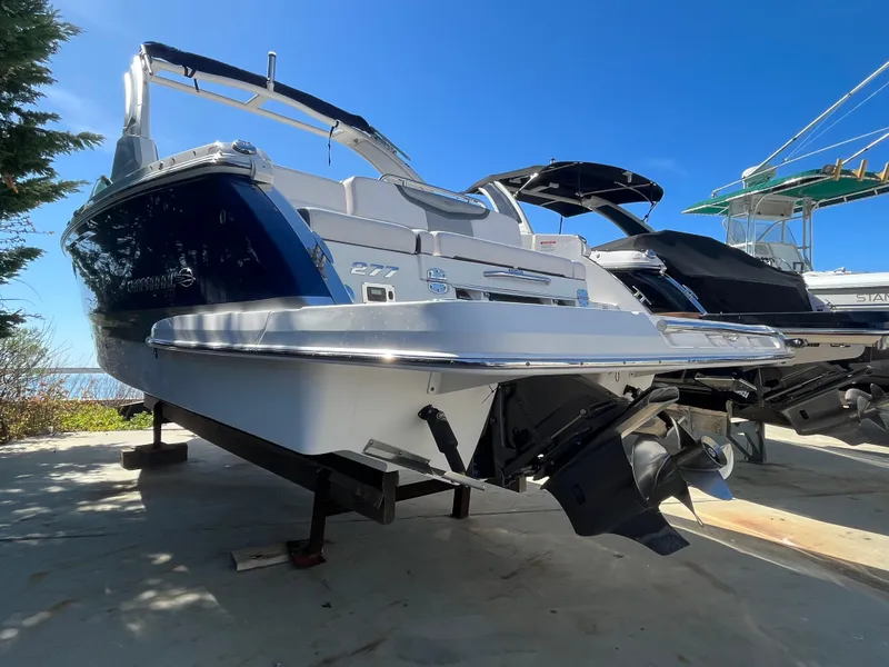 Slide: The Image of 2019 Chaparral 277 SSX boat on display, showcasing sleek design and powerful engine. - 6