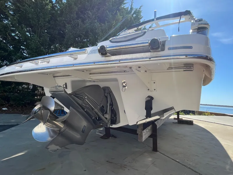 Slide: The Image of 2019 Chaparral 277 SSX boat on trailer, showcasing propeller and stern design. - 8