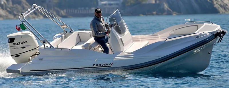 Slide: The Image of 2025 Zar Formenti 59 SL/Limited boat cruising on clear blue water. - 29