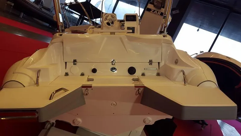 Slide: The Image of 2025 Zar Formenti 59 SL/Limited boat interior with control panel and seating. - 20