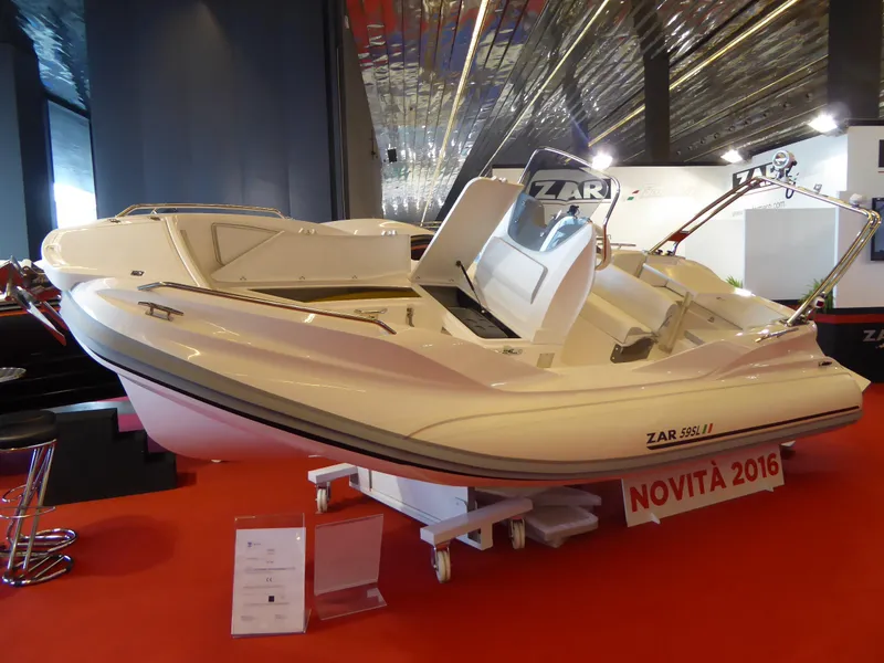 Slide: The Image of 2025 Zar Formenti 59 SL/Limited boat displayed indoors on red carpet. - 23
