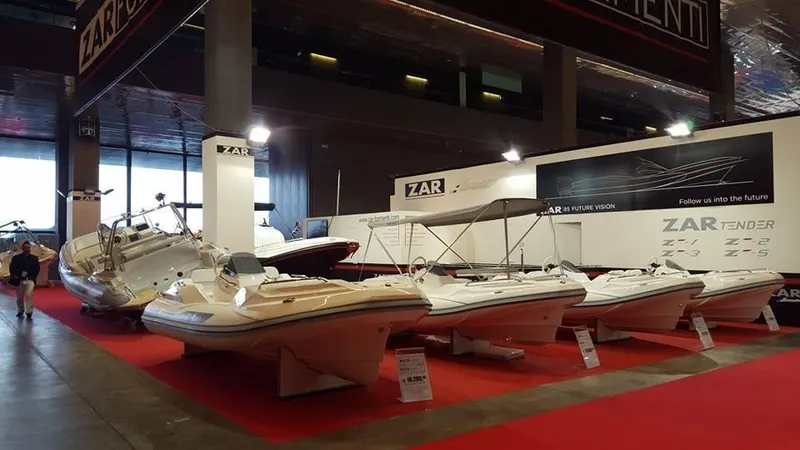 Slide: The Image of Exhibition of Zar Formenti 59 SL/Limited boats, 2025 model, displayed on a red carpet. - 25
