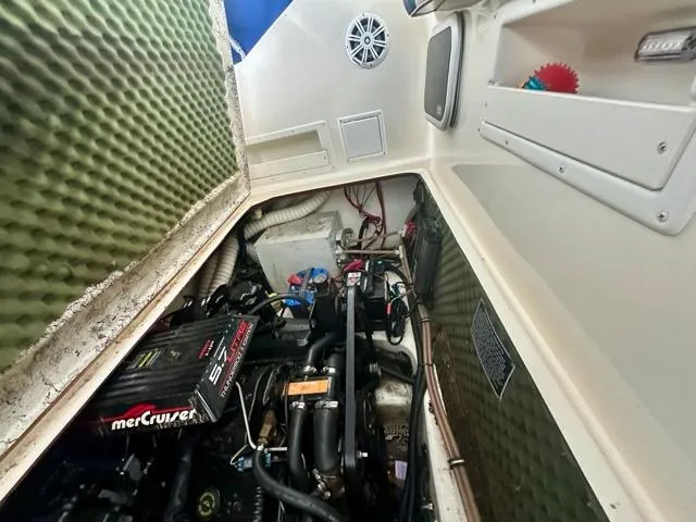Slide: The Image of Engine compartment of a 1998 Rinker Fiesta Vee 266 boat with MerCruiser engine. - 12