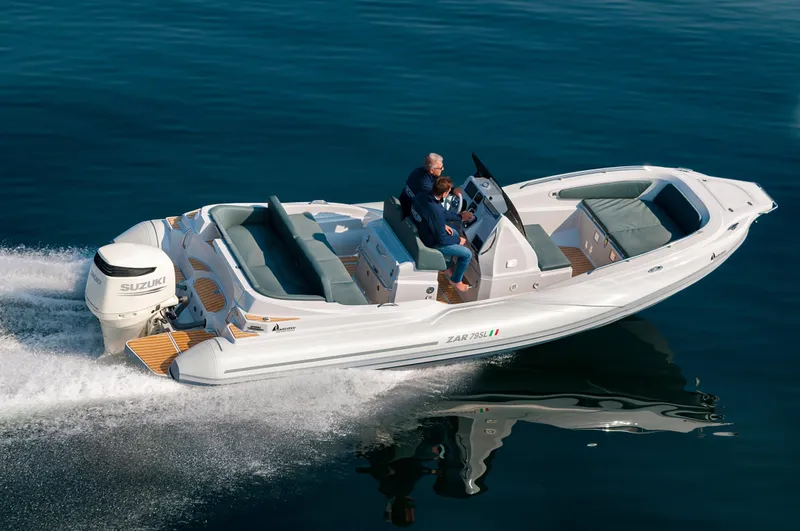 Slide: The Image of 2025 Zar Formenti 79 SL boat cruising on calm water with Suzuki engine. - 2