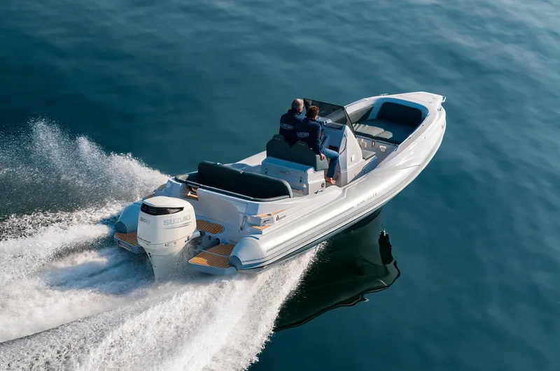 Slide: The Image of 2025 Zar Formenti 79 SL boat cruising on calm water, rear view. - 3