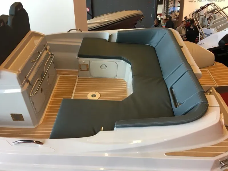 Slide: The Image of 2025 Zar Formenti 79 SL boat interior with cushioned seating and wooden flooring. - 8