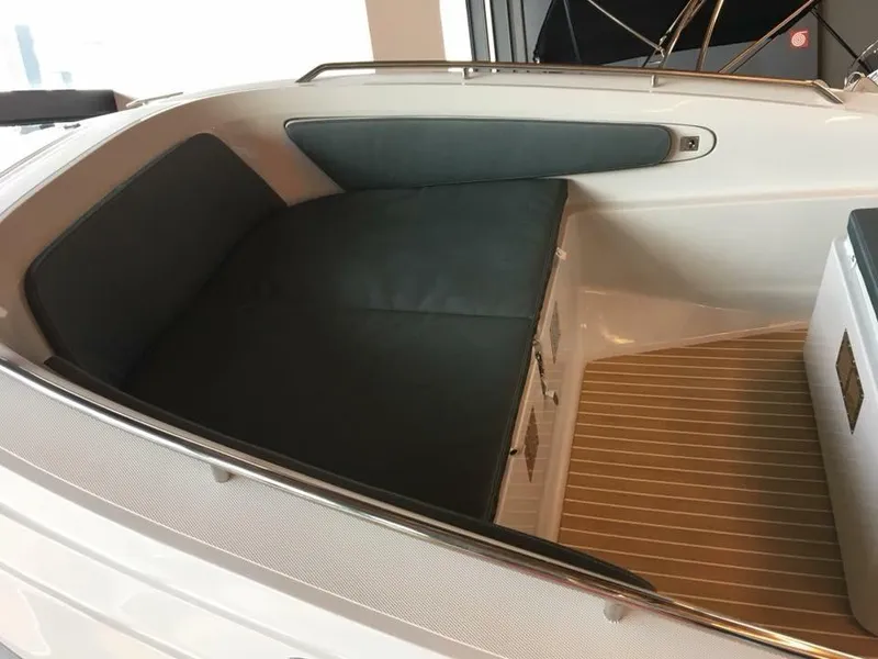 Slide: The Image of 2025 Zar Formenti 79 SL boat interior with cushioned seating and wood flooring. - 9