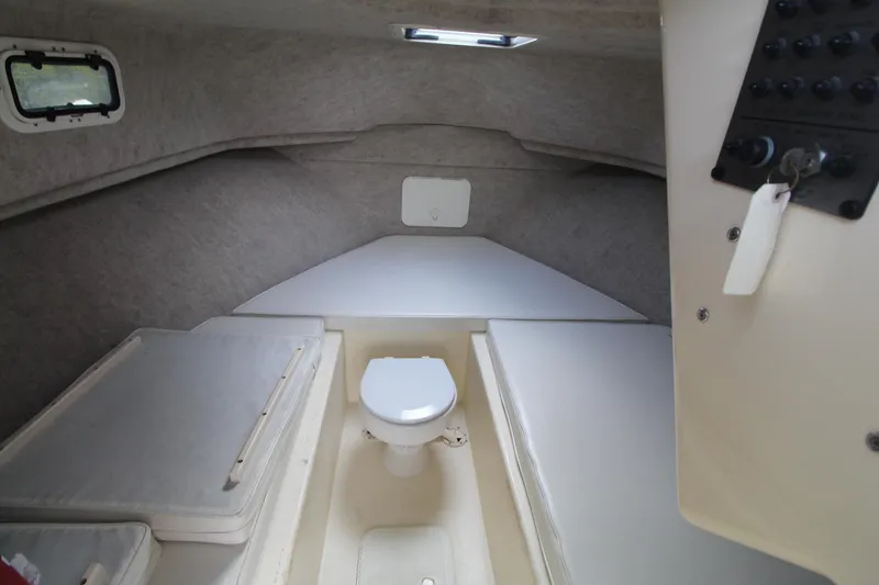 Slide: The Image of 2012 Parker 2510 XLD Walkaround cabin interior with toilet and seating. - 11