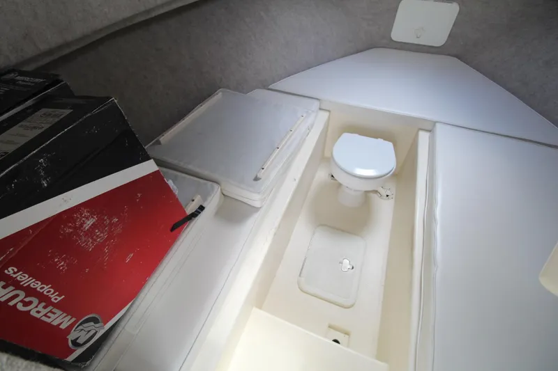 Slide: The Image of 2012 Parker 2510 XLD Walkaround cabin interior with toilet and storage. - 12
