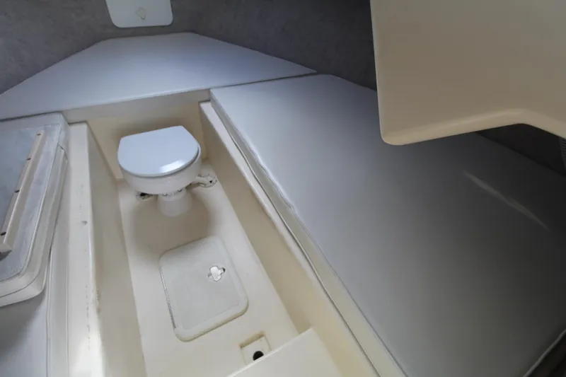 Slide: The Image of 2012 Parker 2510 XLD Walkaround cabin interior with toilet and seating area. - 13