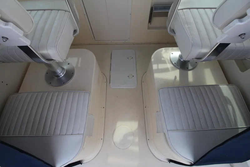 Slide: The Image of Interior seating of 2012 Parker 2510 XLD Walkaround boat, featuring cushioned seats. - 15